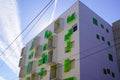 Modern new apartment house residential building with balcony and green plastic design outdoor concept Royalty Free Stock Photo