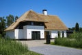 Modern new detached family house with white facade and traditional thatched roof, spacious driveway in rural setting - Netherlands Royalty Free Stock Photo