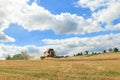 Modern New Holland combine harvester cutting crops Royalty Free Stock Photo