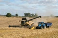 Modern New Holland combine harvester cutting crops