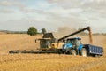 Modern New Holland combine harvester cutting crops Royalty Free Stock Photo