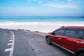 Modern new red SUV car on the road with Summer sea background of free space for summer text and travel transportation background Royalty Free Stock Photo