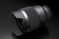 Modern nonexistent DSLR macro camera lens on black background Royalty Free Stock Photo