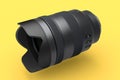 Modern nonexistent DSLR macro camera lens on yellow background