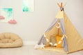 Modern nursery room interior with play tent