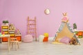 Modern nursery room interior with play tent