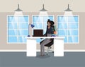 Modern office with black businesswoman sitting