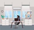 Modern office with black businesswoman sitting