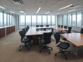 modern office boardroom and meeting room interior with desks, chairs and cityscape view. Royalty Free Stock Photo