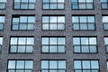 Modern office brick building window facade with sky reflection Royalty Free Stock Photo