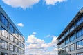 Modern office building against blue cloudy sky Royalty Free Stock Photo