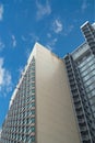 Modern office building against blue sky. Low angle shot. Royalty Free Stock Photo