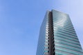 Modern office building against clear blue sky.