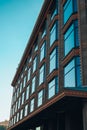 Modern office building, detailed view of finance house windows. Pattern. Office building, blue glass wall reflection detail. Clear Royalty Free Stock Photo