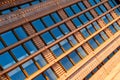 Modern office building, detailed view of finance house windows. Pattern. Office building, blue glass wall reflection detail. Clear Royalty Free Stock Photo