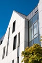 Modern office building exterior with glass facade on clear sky background. Transparent glass wall of office building Royalty Free Stock Photo