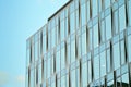 Modern office building facade abstract fragment, shiny windows in steel structure. Royalty Free Stock Photo