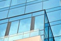 Modern office building facade abstract fragment, shiny windows in steel structure.