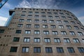 Modern office building facade with geometric windows against a clear blue sky in Leeds, UK Royalty Free Stock Photo