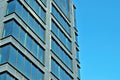 Modern office building with facade of glass. Royalty Free Stock Photo