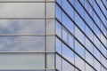 Modern office building fasade with clouds reflected in windows Royalty Free Stock Photo