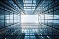 Modern office building with futuristic design, bottom view of courtyard-well and blue sky. Geometric facade with glass and steel. Royalty Free Stock Photo