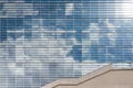 Modern office building glass facade with sky reflection Royalty Free Stock Photo