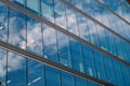 Modern office building glass facade, sky reflection in the windows of skyscraper Royalty Free Stock Photo