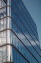 Modern office building glass facade, sky reflection in the windows of skyscraper Royalty Free Stock Photo