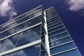 Modern office building reflecting clouds Royalty Free Stock Photo