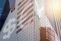 Modern office building with signs Euro, dollar, yuan on a background of the blue sky Royalty Free Stock Photo