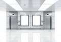 Modern office building with two elevators and blank framed walls in a clean hallway Royalty Free Stock Photo