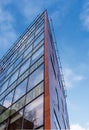 Modern office building wall made of steel and glass with blue sky Royalty Free Stock Photo