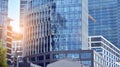 Office building, details of blue glass wall and sun reflections. Royalty Free Stock Photo