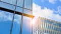 Office building, details of blue glass wall and sun reflections. Royalty Free Stock Photo