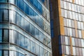 Modern Office Buildings with Glass Windows and Sky Reflections on a sunny day Royalty Free Stock Photo