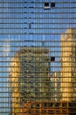 Modern office buildings reflected in glass windows Royalty Free Stock Photo