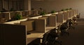 Modern office cubicles arranged in a long row with empty workspa Royalty Free Stock Photo