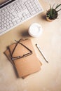 Modern office desk table with laptop computer, notepad, tablet, plant, glasses and pen Royalty Free Stock Photo