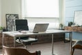 Modern office interior design with office chair and desk in front of windows. Workplace Royalty Free Stock Photo