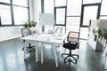 modern office interior with desk, papers, chairs Royalty Free Stock Photo