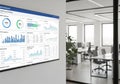 Modern office interior featuring a large digital screen on a wall, Royalty Free Stock Photo