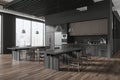 Modern office interior with kitchen shelves, eating tables with panoramic window Royalty Free Stock Photo