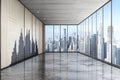 modern empty office interior with panoramic floor to ceiling windows overlooking a city skyline with skyscrapers Royalty Free Stock Photo
