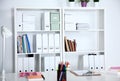 Modern office interior with tables, chairs and bookcases Royalty Free Stock Photo