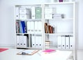 Modern office interior with tables, chairs and bookcases Royalty Free Stock Photo