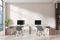 A modern office interior with two computer workstations, chairs, and a shelving unit on a bright background, concept of a Royalty Free Stock Photo