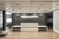 Modern office lobby interior with reception desk, wooden flooring and daylight. Royalty Free Stock Photo