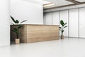 Modern office lobby interior with wooden reception desk and mock up place on concrete wall. Royalty Free Stock Photo