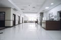 A modern office lobby with a wooden reception desk, white tiled floor, seating area with sofa and armchairs, and diffused lighting Royalty Free Stock Photo